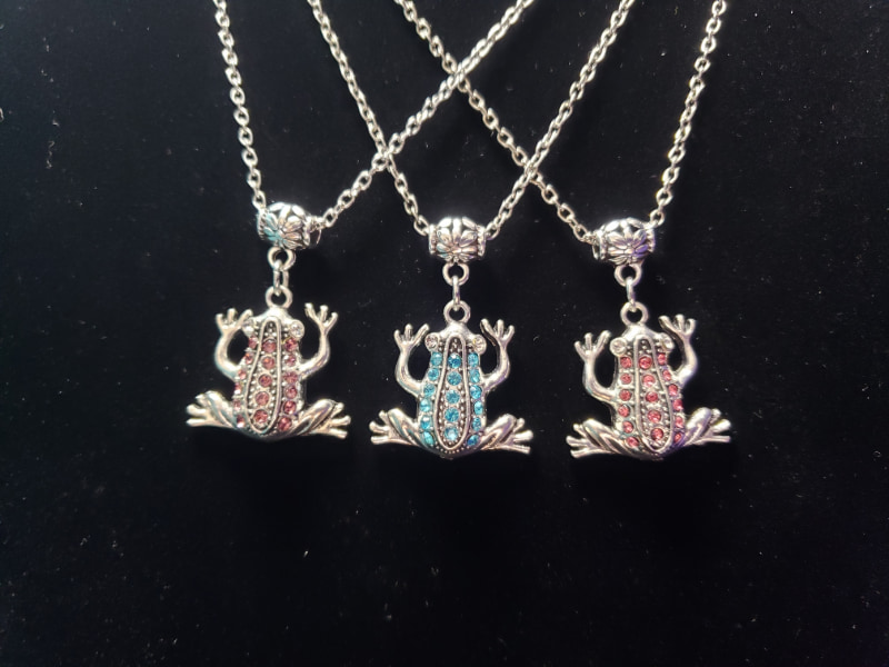 Three Silver Frogs